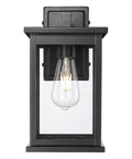 Bowton II Outdoor Wall Light - Dusk to Dawn Matte Black Finish with Glass Shade by Millennium Lighting - 11"H