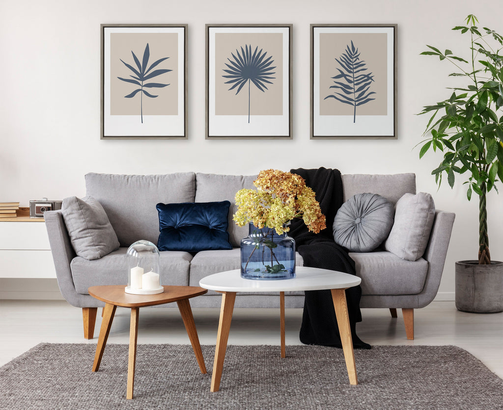 Sylvie Muted Tan and Blue Colorblock Botanical Palm Framed Canvas by The Creative Bunch Studio