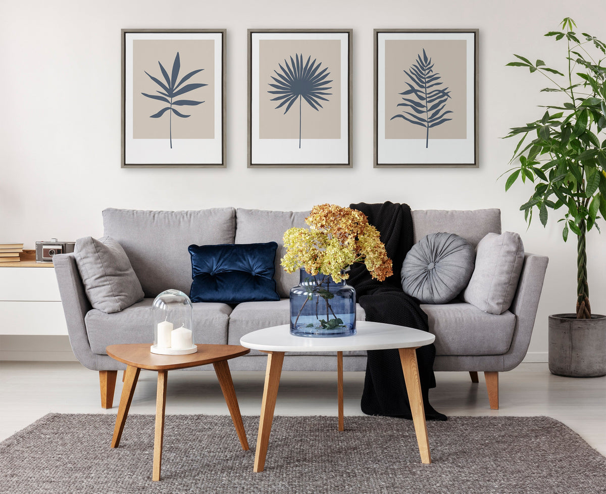 Sylvie Muted Tan and Blue Colorblock Botanical Palm Framed Canvas by The Creative Bunch Studio
